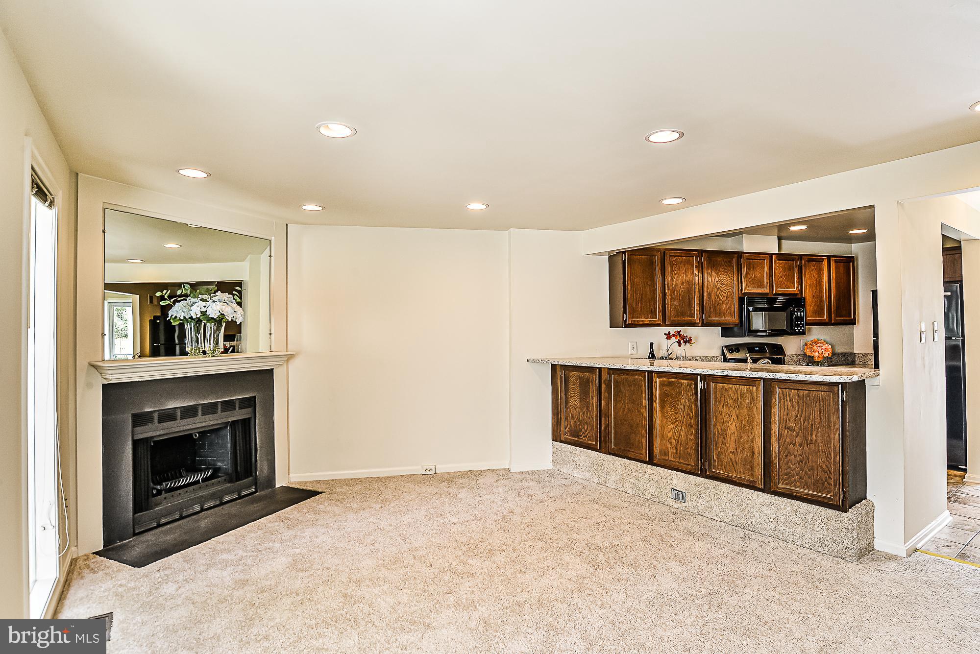 2155 Whisper Way Reston, VA 20191 - Photo 7 of 32 Relaxing family with cozy wood-burning fireplace