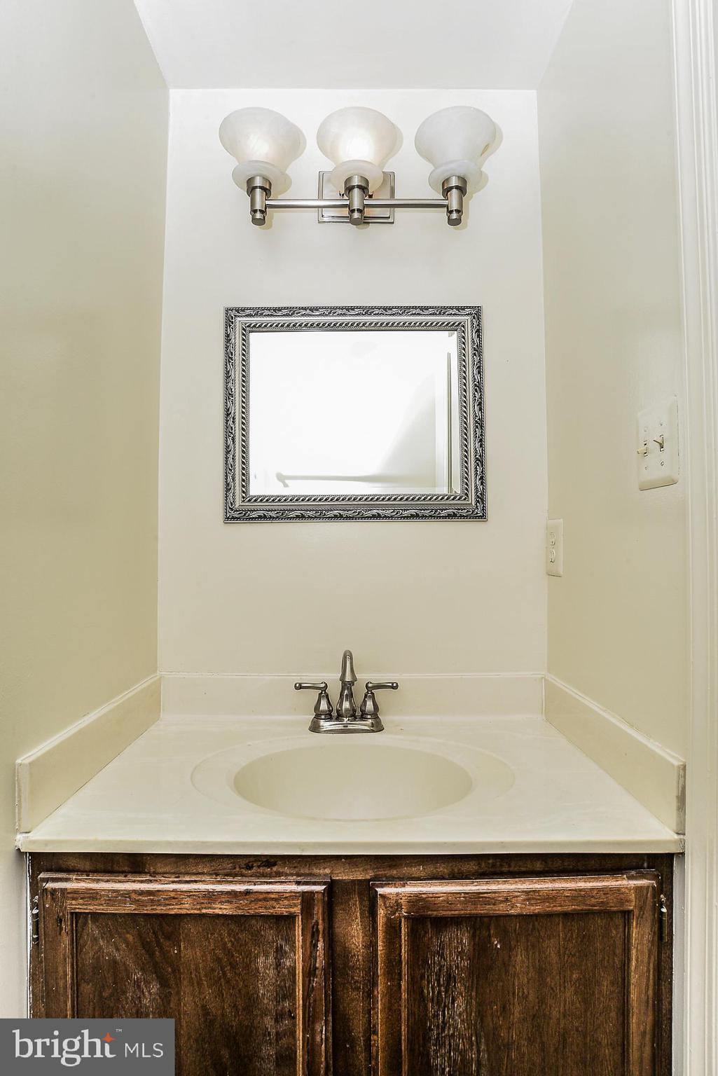 2155 Whisper Way Reston, VA 20191 - Photo 8 of 32 Half bath w/ designer mirror & contemporary light