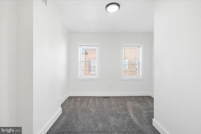 an empty room with windows