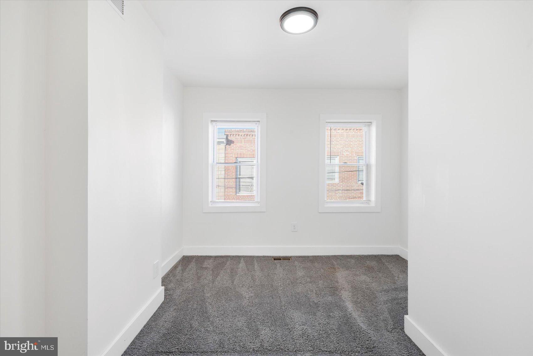 847 Reinhardt Street Baltimore, MD 21230 - Photo 17 of 41 an empty room with windows