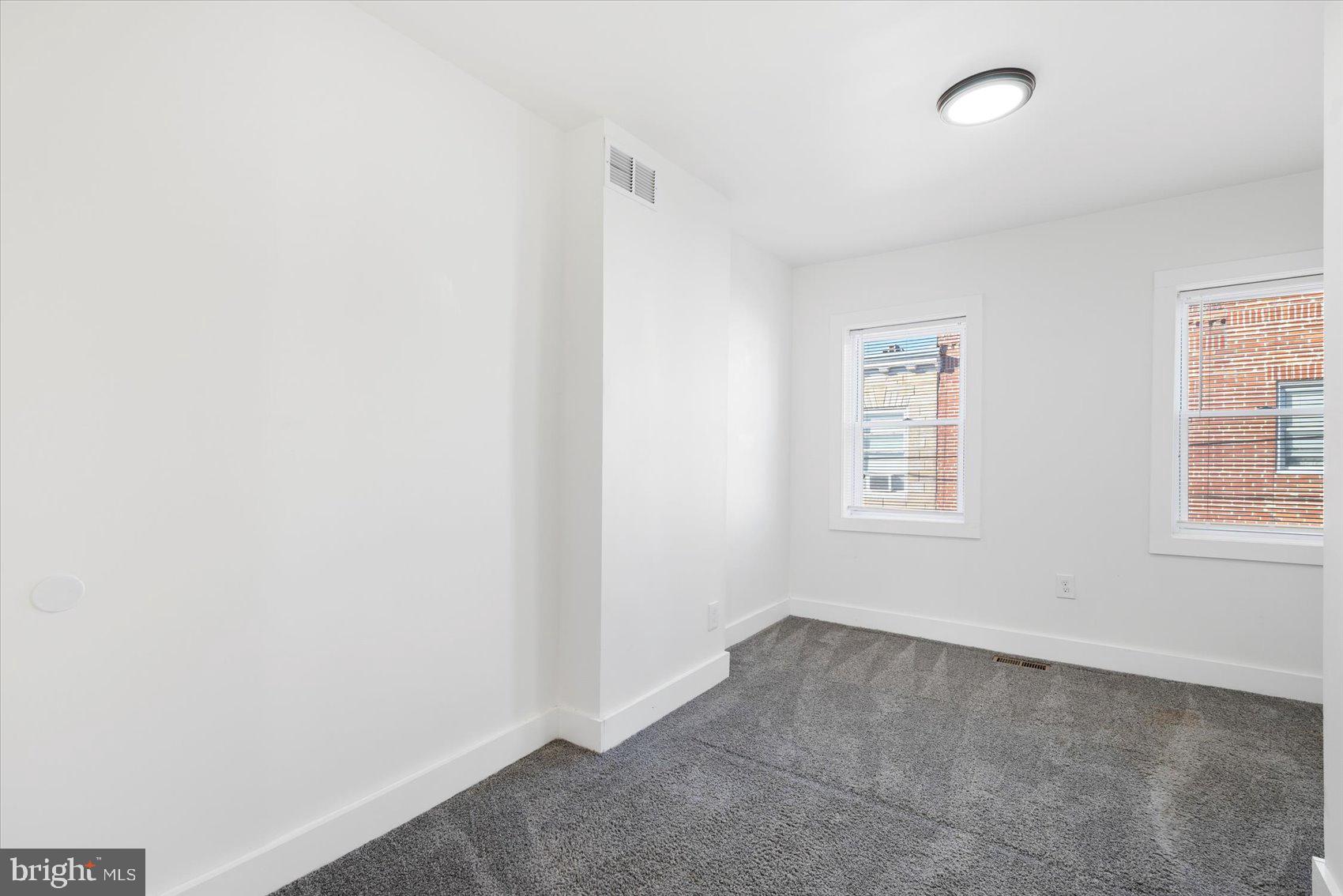 847 Reinhardt Street Baltimore, MD 21230 - Photo 18 of 41 an empty room with windows