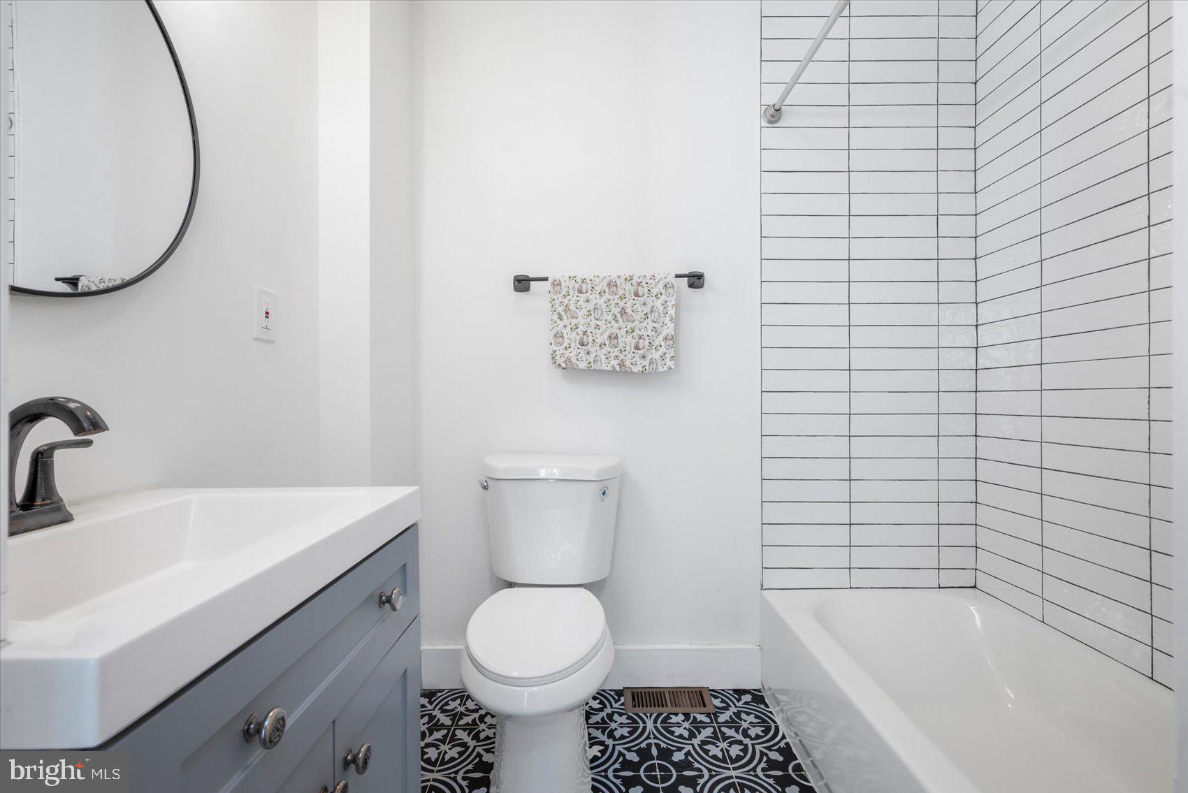 847 Reinhardt Street Baltimore, MD 21230 - Photo 22 of 41 a bathroom with a sink toilet and shower