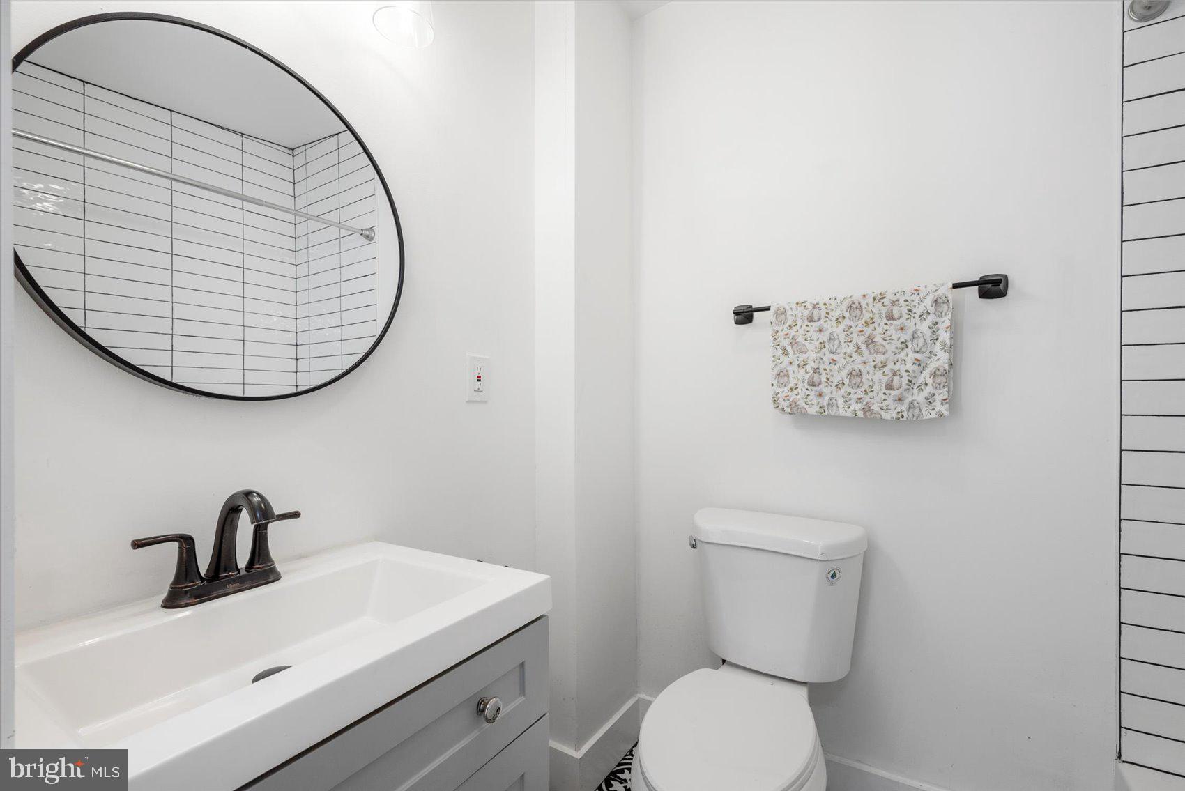 847 Reinhardt Street Baltimore, MD 21230 - Photo 25 of 41 a bathroom with a toilet and a sink