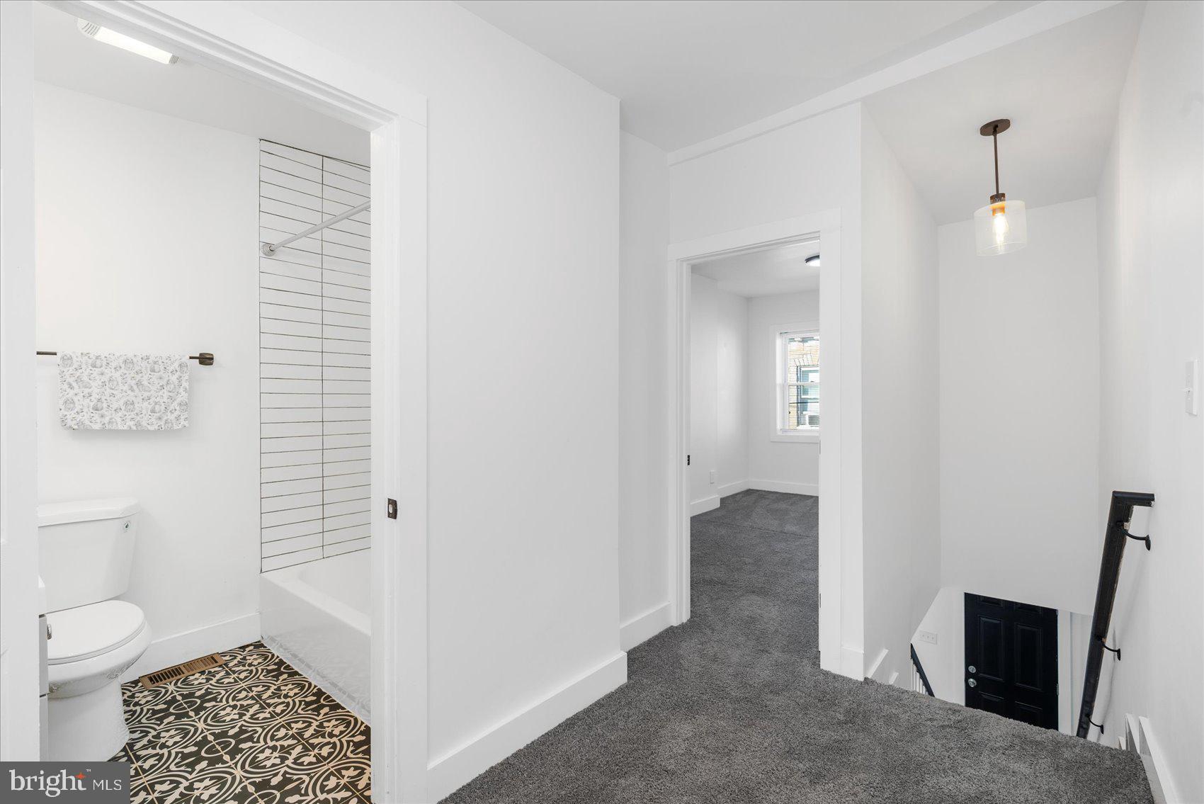 847 Reinhardt Street Baltimore, MD 21230 - Photo 26 of 41 a bathroom with a toilet and a shower