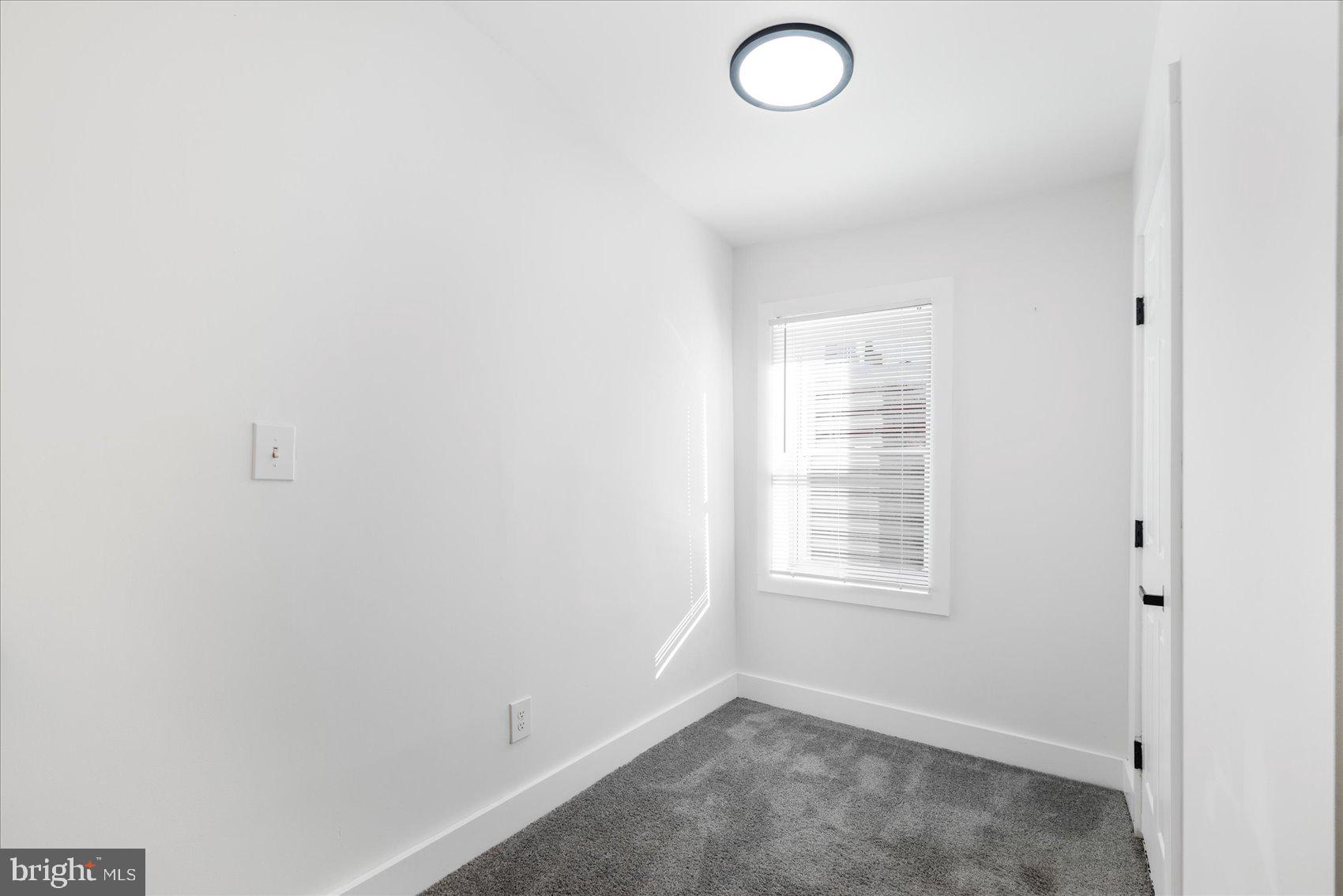 847 Reinhardt Street Baltimore, MD 21230 - Photo 27 of 41 an empty room with windows