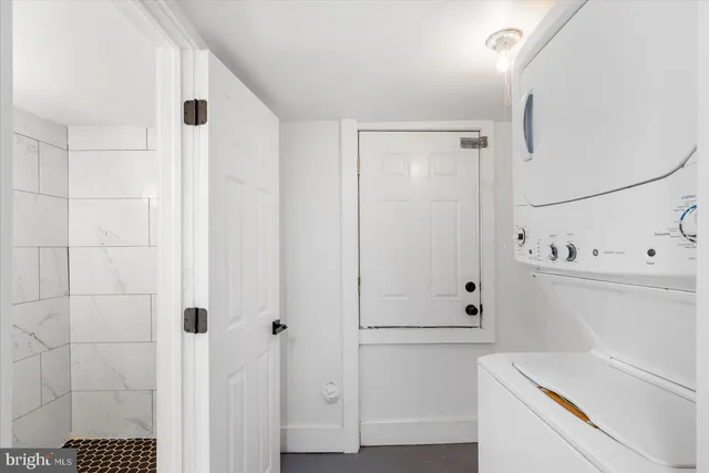 a view of kitchen with white cabinets