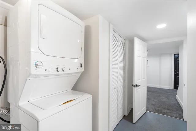 a bathroom with a toilet and a mirror