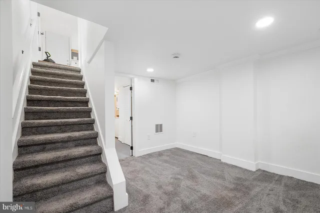 a view of entryway with stairs