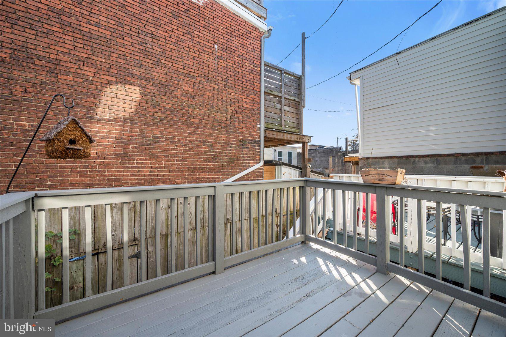 847 Reinhardt Street Baltimore, MD 21230 - Photo 38 of 41 a view of a balcony with wooden floor