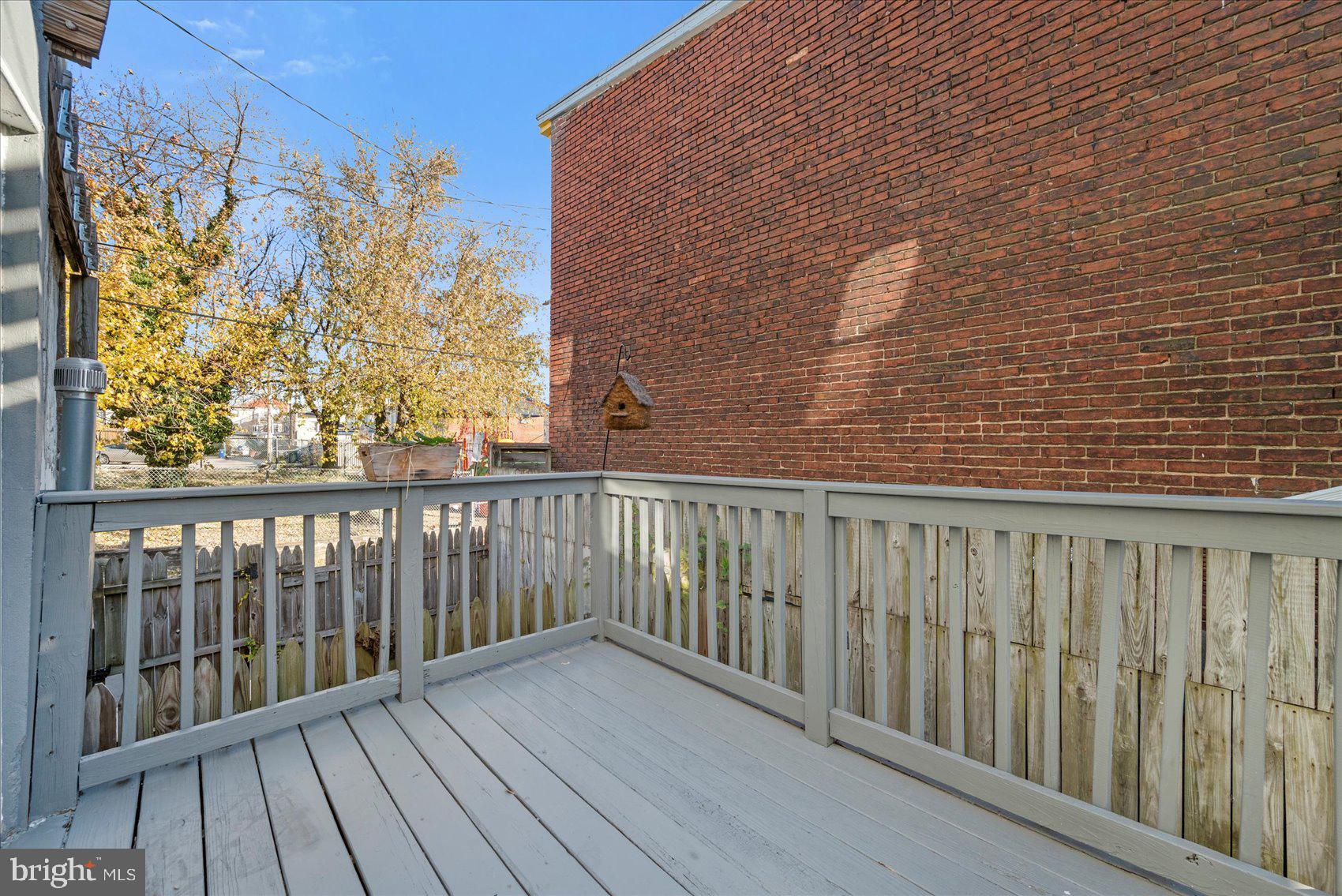 847 Reinhardt Street Baltimore, MD 21230 - Photo 39 of 41 a balcony with wooden floor