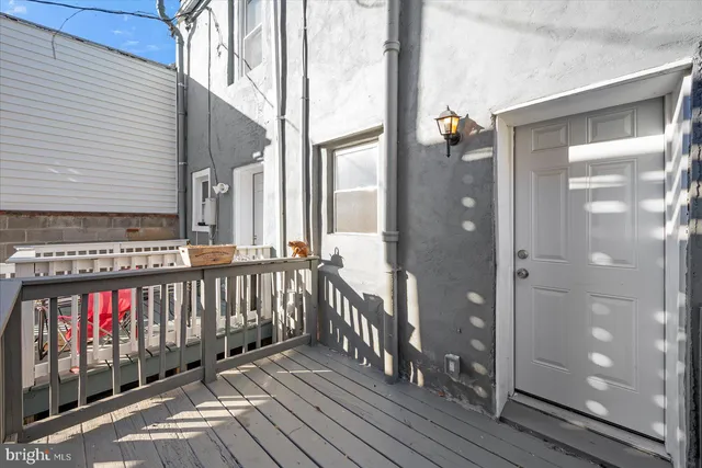 a view of a balcony with wooden floor