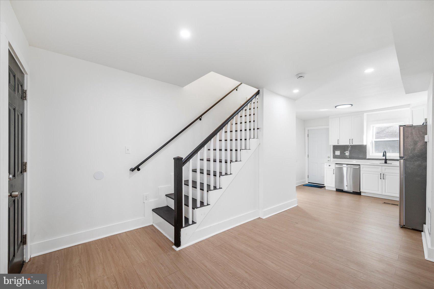847 Reinhardt Street Baltimore, MD 21230 - Photo 8 of 41 a view of a kitchen with wooden floor and electronic appliances