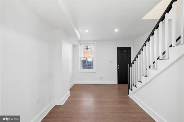 a view of entryway with wooden floor