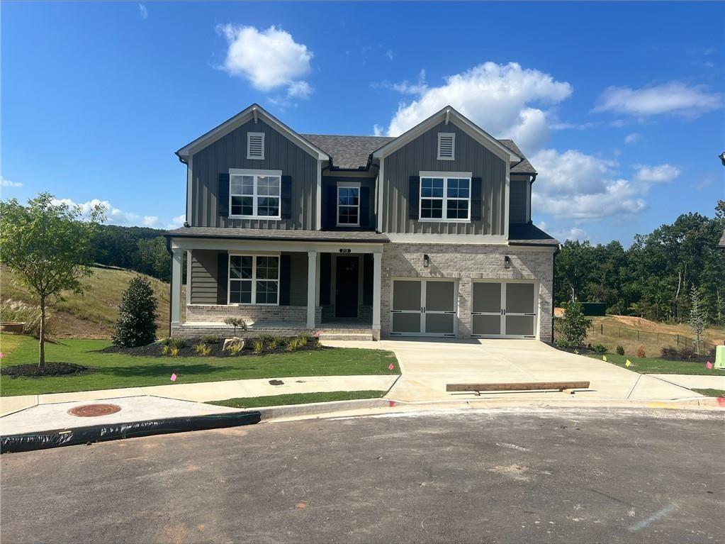 219 Willow Street Canton, GA 30114 - Photo 1 of 24 a front view of a house with a yard