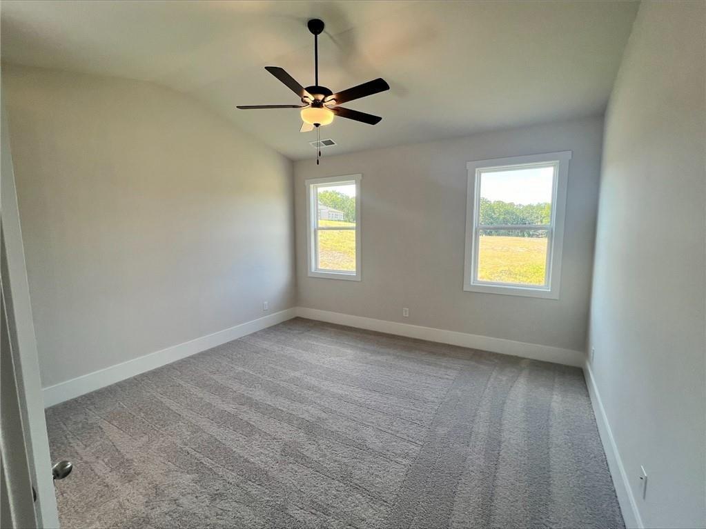 219 Willow Street Canton, GA 30114 - Photo 18 of 24 a view of an empty room with a window