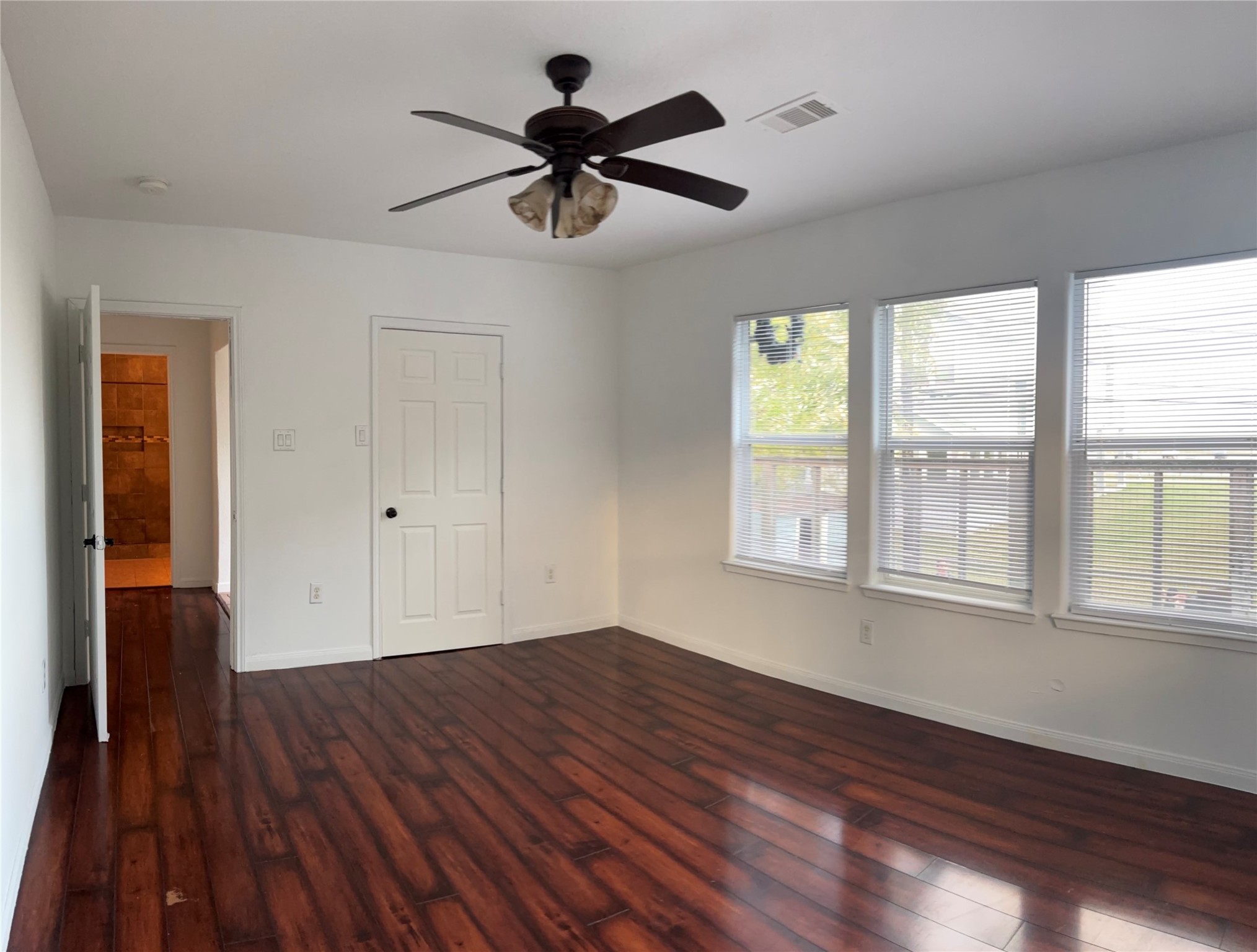 4911 Oleander Street, Unit B Pasadena, TX 77586 - Photo 22 of 34 a view of empty room with wooden floor and fan