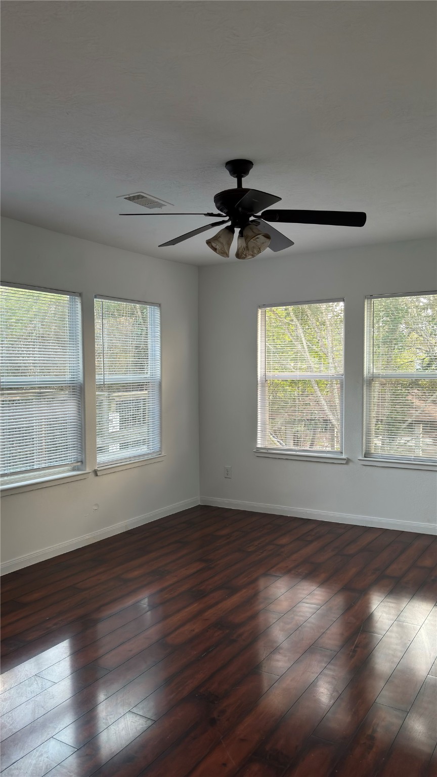4911 Oleander Street, Unit B Pasadena, TX 77586 - Photo 23 of 34 a view of an empty room with wooden floor and a window