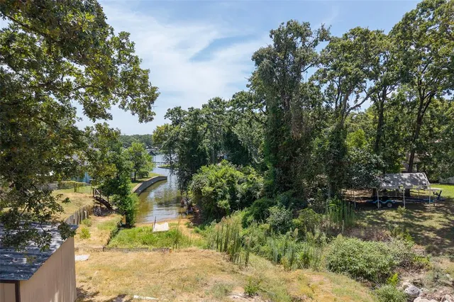 a backyard of a house with lots of green space