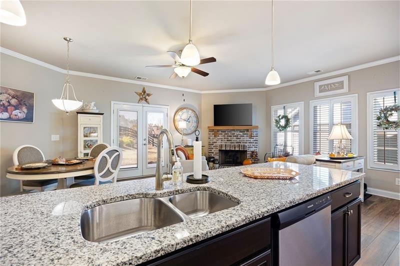 80 Azalea Crossing Dallas, GA 30132 - Photo 13 of 38 a kitchen with granite countertop a sink and a stove