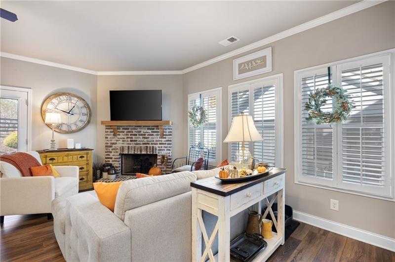 80 Azalea Crossing Dallas, GA 30132 - Photo 14 of 38 a living room with furniture a fireplace and a large window