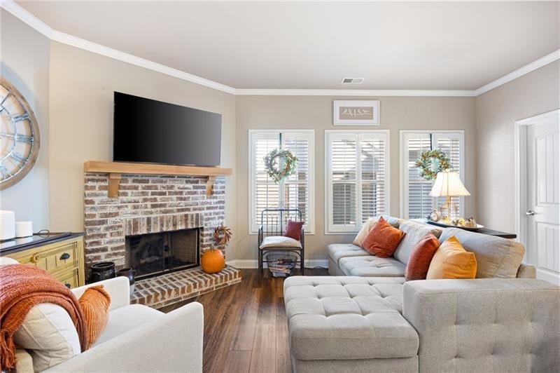 80 Azalea Crossing Dallas, GA 30132 - Photo 15 of 38 a living room with furniture a fireplace and a flat screen tv