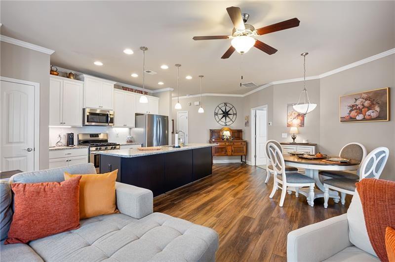 80 Azalea Crossing Dallas, GA 30132 - Photo 17 of 38 a living room with stainless steel appliances kitchen island granite countertop furniture wooden floor and a kitchen view