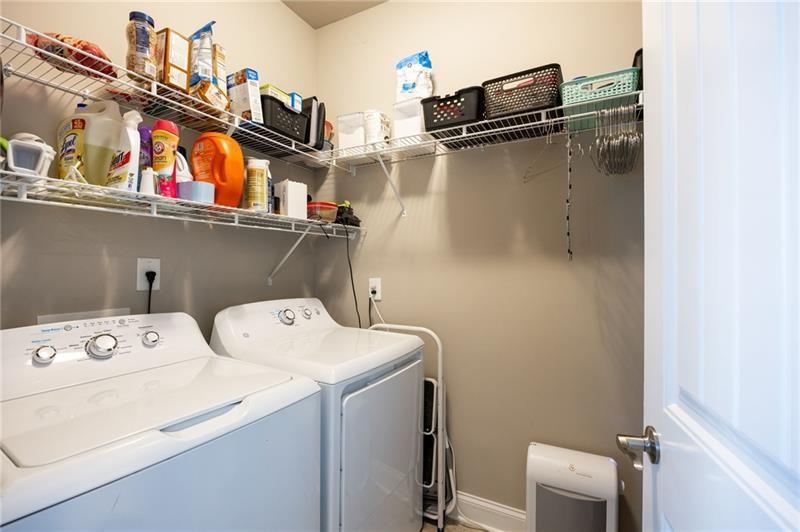 80 Azalea Crossing Dallas, GA 30132 - Photo 19 of 38 a utility room with dryer and washer