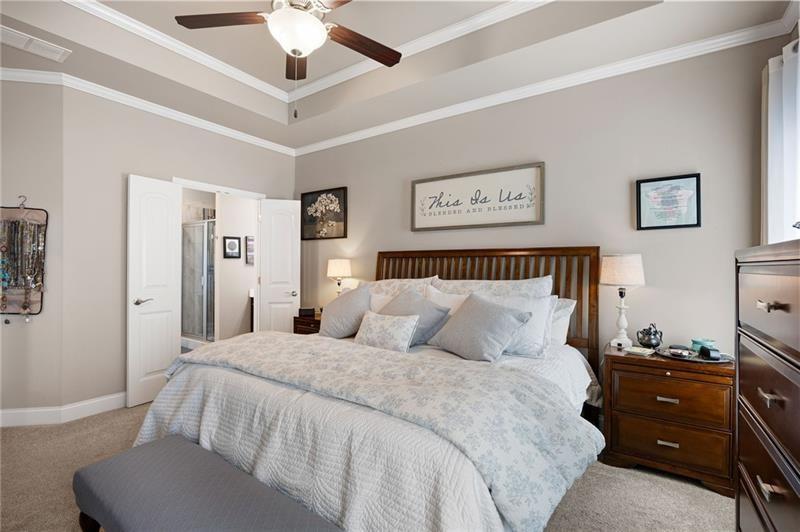 80 Azalea Crossing Dallas, GA 30132 - Photo 22 of 38 a bedroom with a bed and a chandelier fan