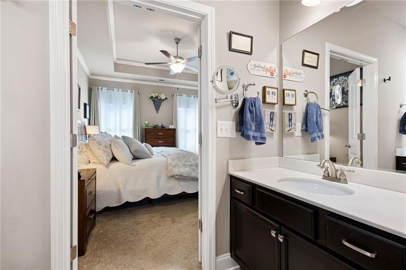 80 Azalea Crossing Dallas, GA 30132 - Photo 24 of 38 a en suite bathroom with a double vanity sink and a mirror