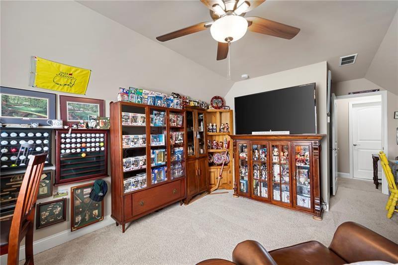 80 Azalea Crossing Dallas, GA 30132 - Photo 27 of 38 a living room with furniture and a flat screen tv