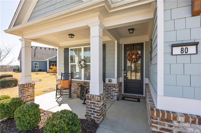 80 Azalea Crossing Dallas, GA 30132 - Photo 3 of 38 a view of a patio with table and chairs potted plants and floor to ceiling window