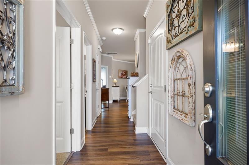 80 Azalea Crossing Dallas, GA 30132 - Photo 4 of 38 a view of a hallway with wooden floor and staircase