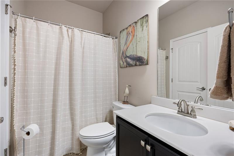 80 Azalea Crossing Dallas, GA 30132 - Photo 7 of 38 a bathroom with a granite countertop sink and a mirror