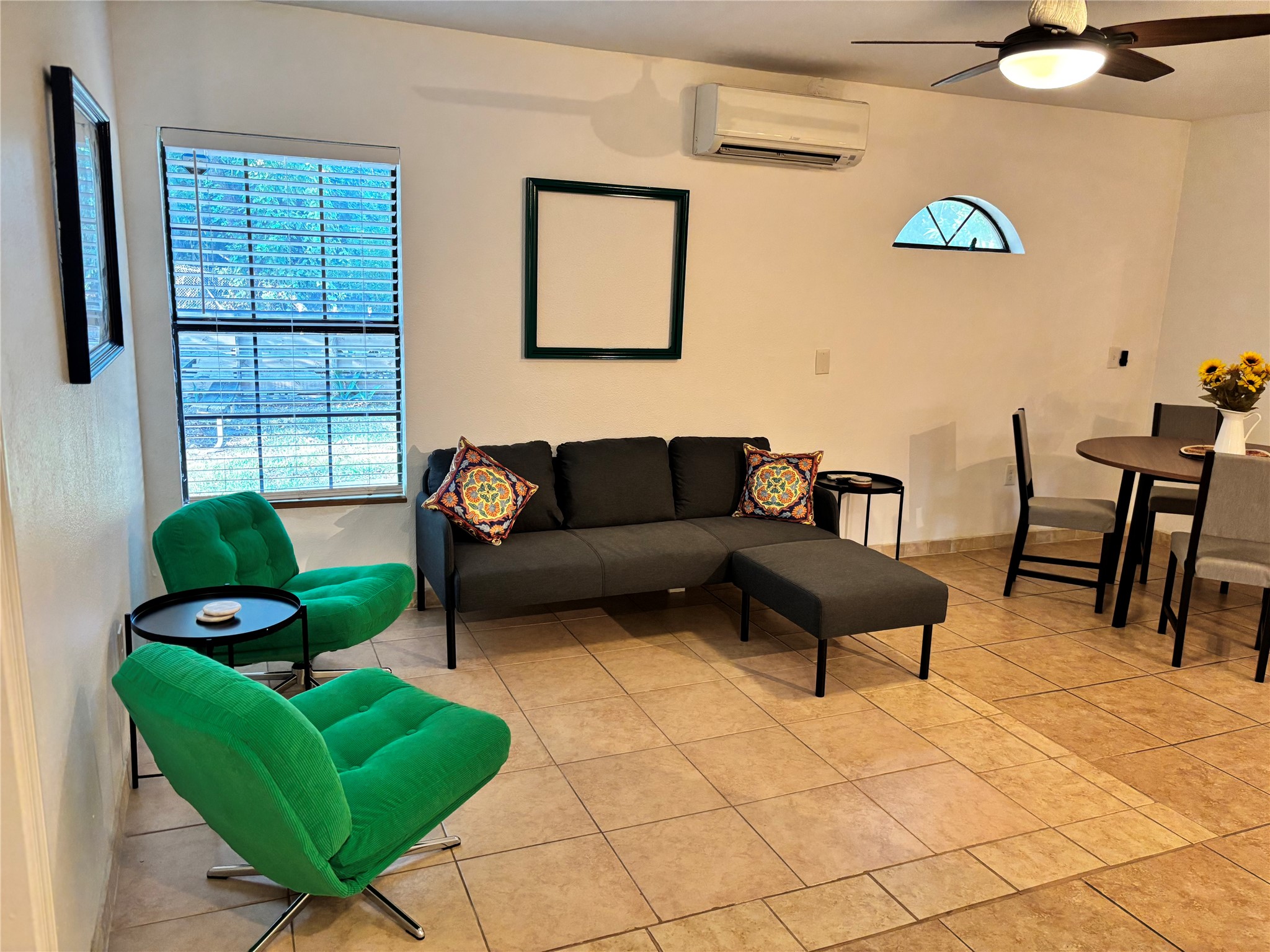 a living room with furniture and a window