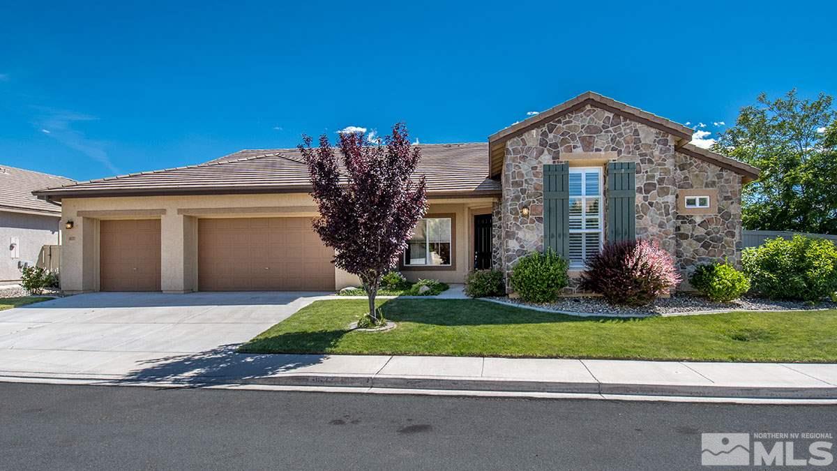 1632 Broadstone Way Reno, NV 89521 - Photo 1 of 1 a front view of a house with a yard and potted plants