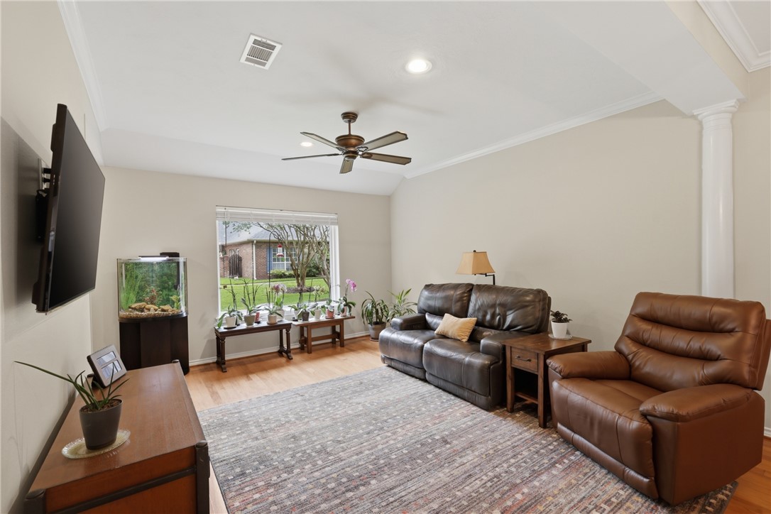 1520 Bennett Street Bryan, TX 77802 - Photo 5 of 24 a living room with furniture ceiling fan and a window