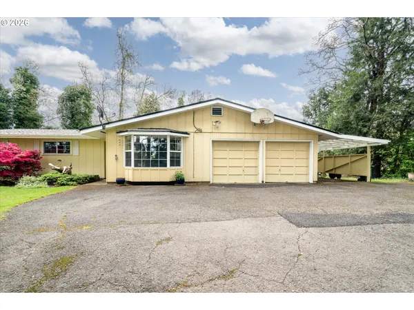 a front view of a house with a garage