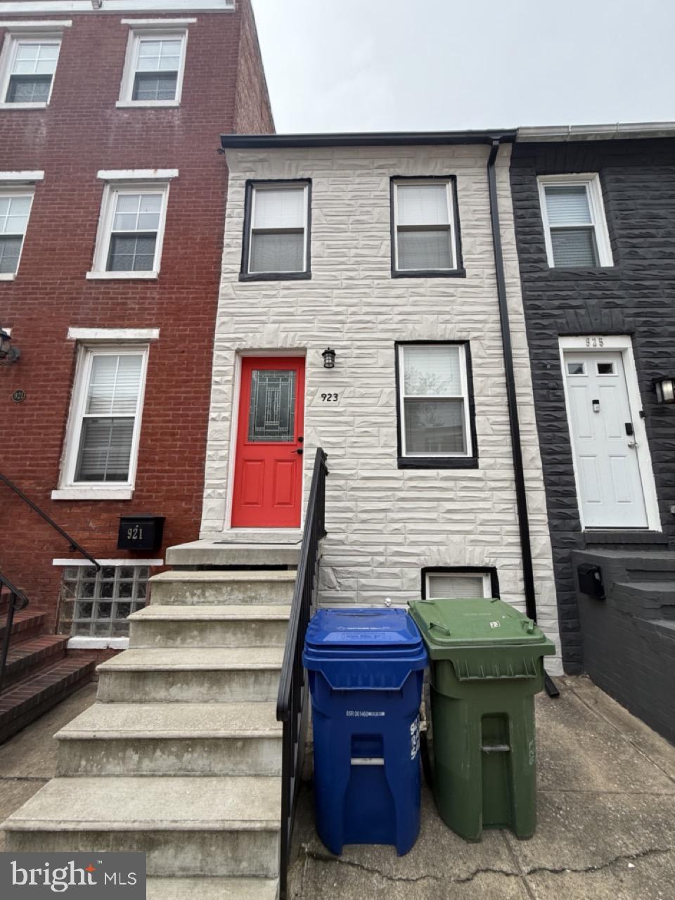 923 Ramsay Street, Unit B Baltimore, MD 21223 - Photo 2 of 9 a view of a brick building with many windows
