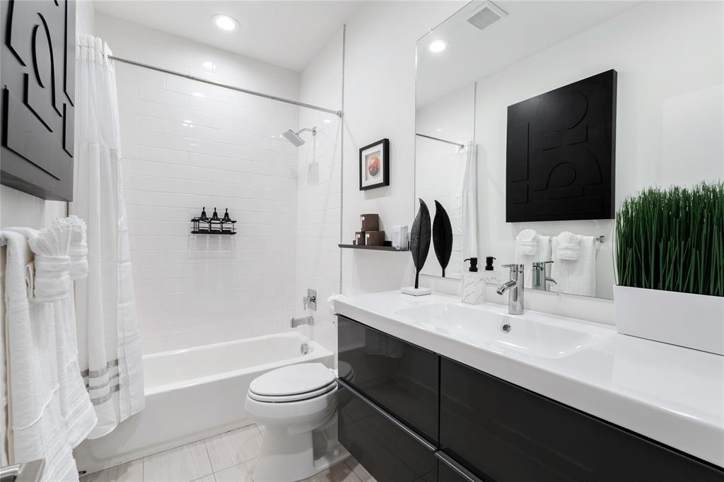 1002 Mobile Street, Unit 1 Dallas, TX 75208 - Photo 24 of 34 a bathroom with a sink a toilet and shower