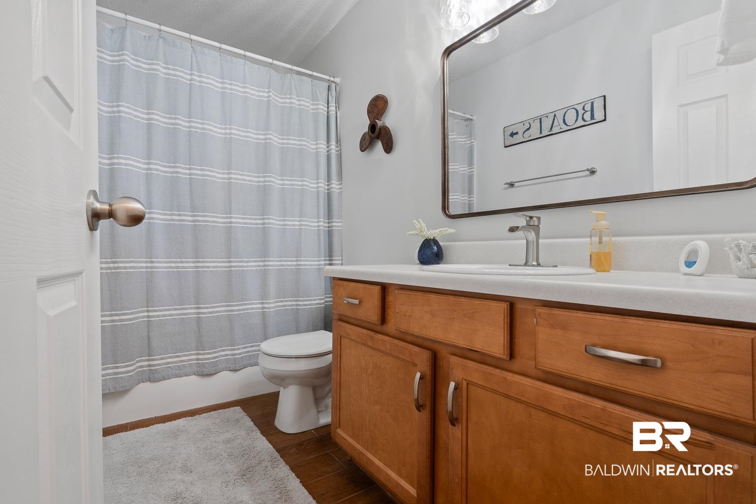 22764 Respite Lane Foley, AL 36535 - Photo 27 of 46 Full bathroom featuring vanity, toilet, and wood finished floors