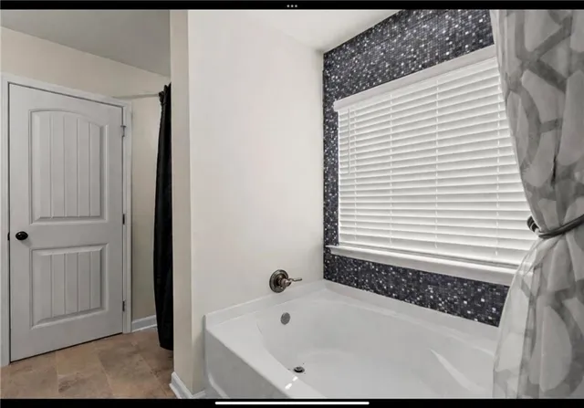 a bathroom with a bathtub