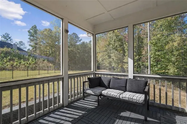 a view of a two chairs in the balcony