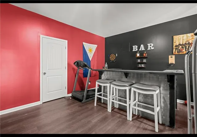 a view of a room with wooden furniture