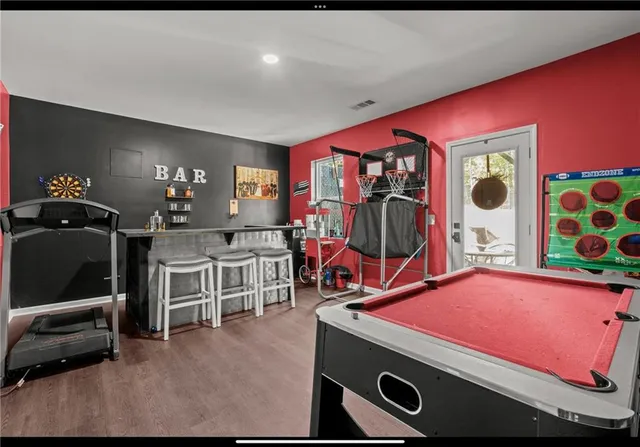 a room with gym equipment and a window