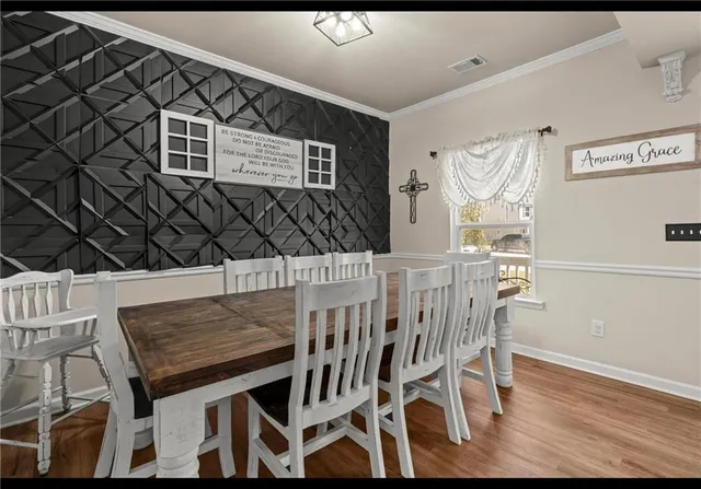 a dining room with a table and chairs