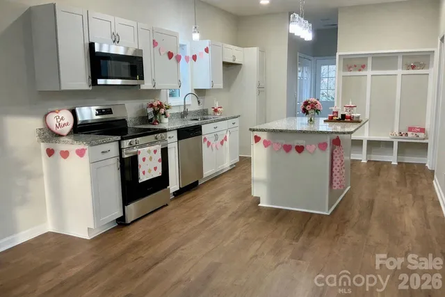 a kitchen with a stove and a microwave