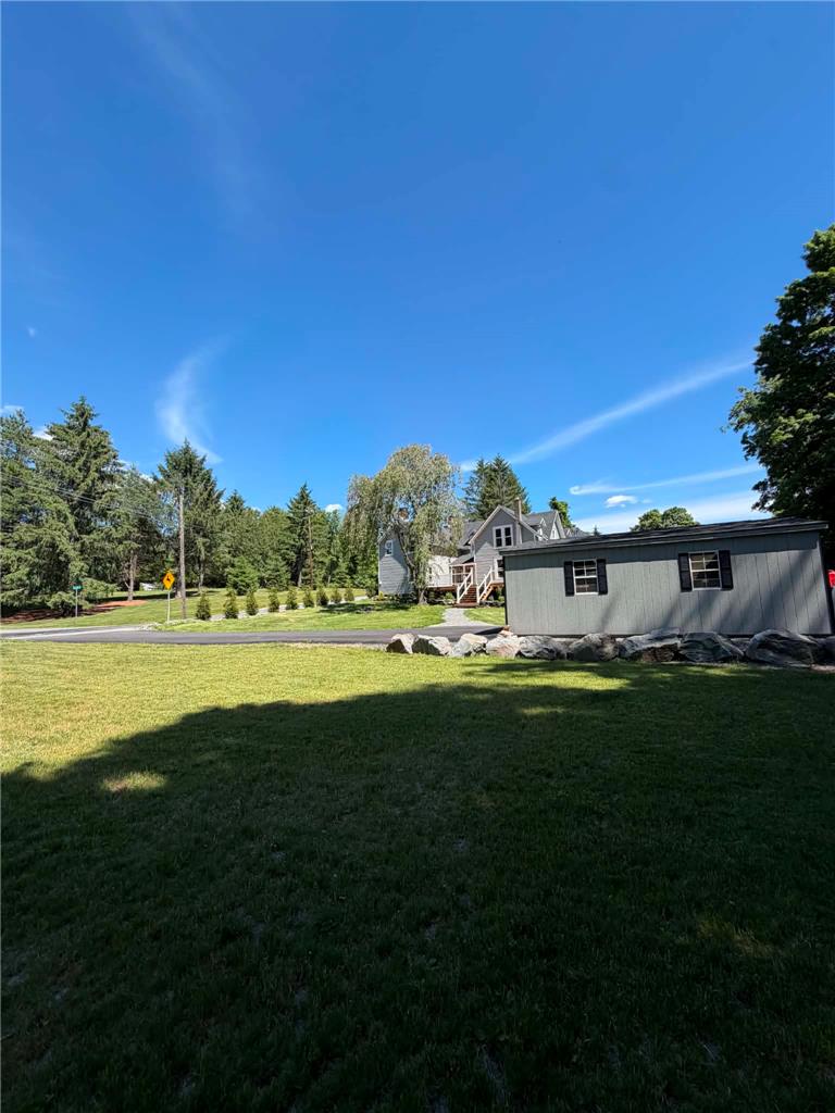 164 Sand Spring Road Cresco, PA 18326 - Photo 56 of 60 A neatly maintained lawn and charming outbuilding complement this serene property.