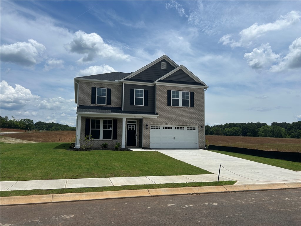 217 Bellflower Lane Anderson, SC 29625 - Photo 2 of 27 A well-maintained lawn and extended driveway enhance this inviting two-story residence.