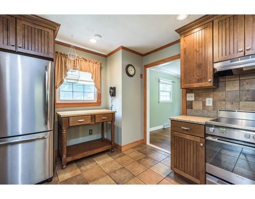 37 Packard Road Stow, MA 01775 - Photo 4 of 42 a kitchen with stainless steel appliances granite countertop a refrigerator a stove and a sink with cabinets
