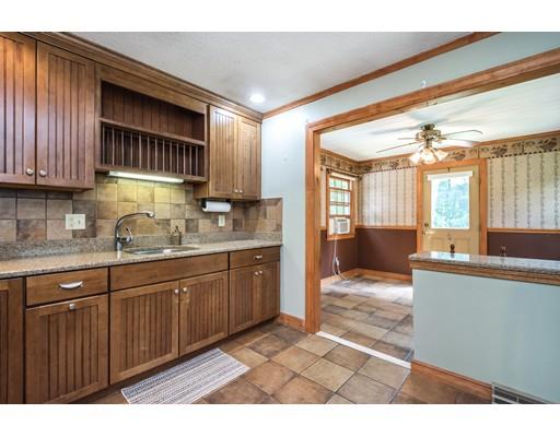37 Packard Road Stow, MA 01775 - Photo 7 of 42 a kitchen with stainless steel appliances granite countertop a sink and cabinets